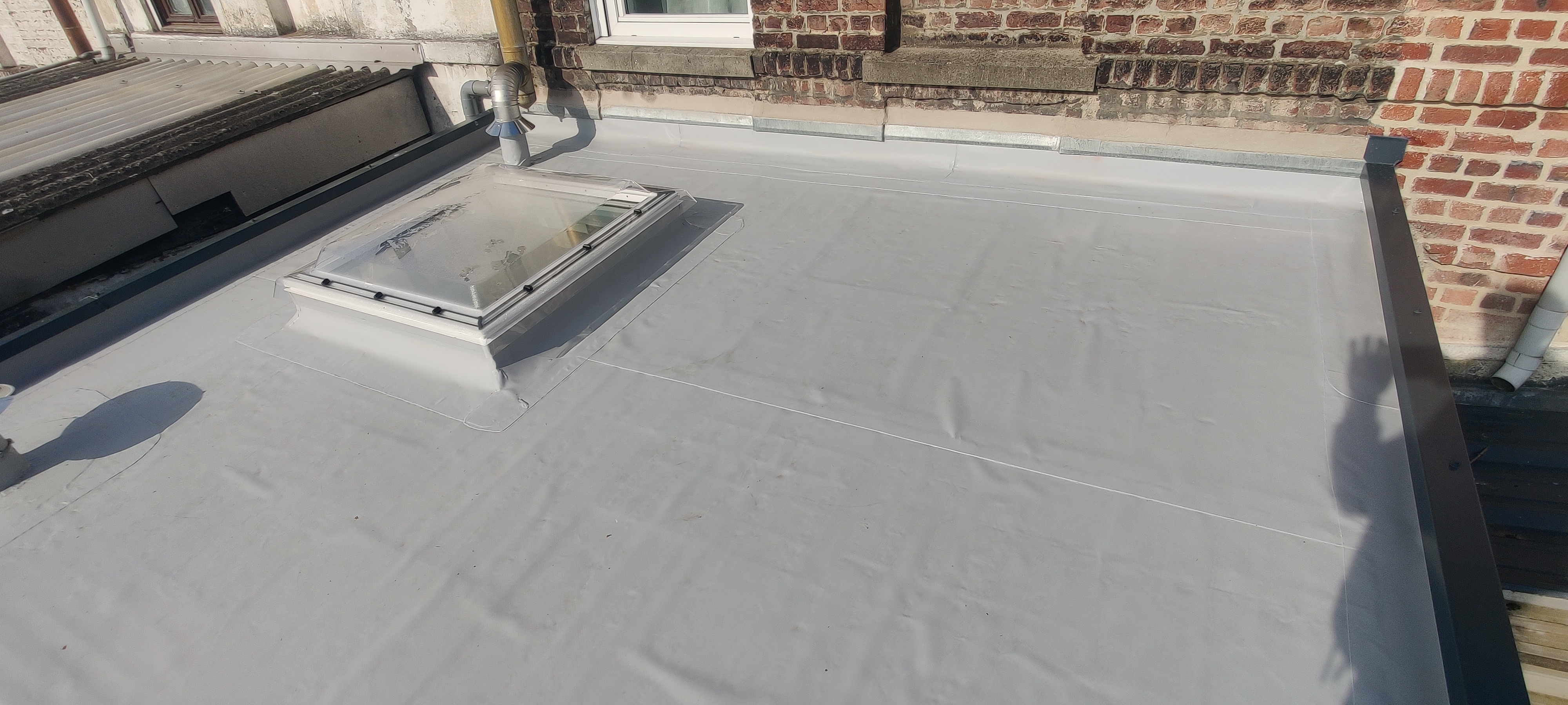 Rénovation toiture plate Croix