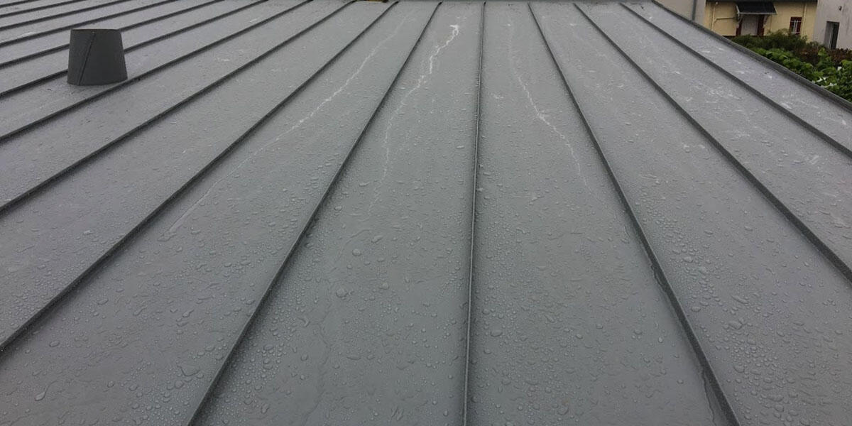 Réalisation d’une couverture en zinc pour une toiture durable et esthétique à Genech