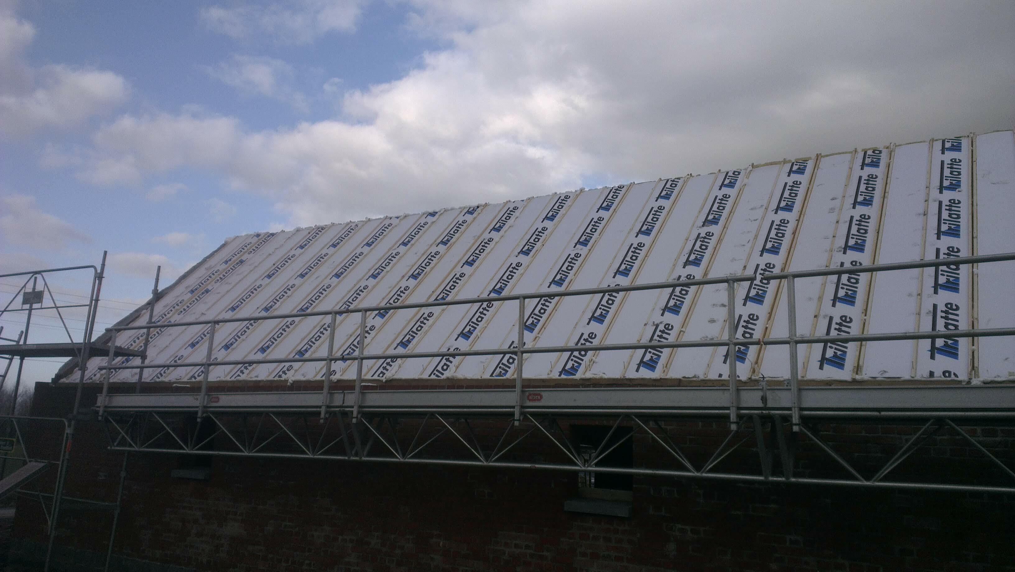 Isolation de toiture par sarking réalisée pour améliorer le confort thermique du logement à Templeuve-en-Pévèle